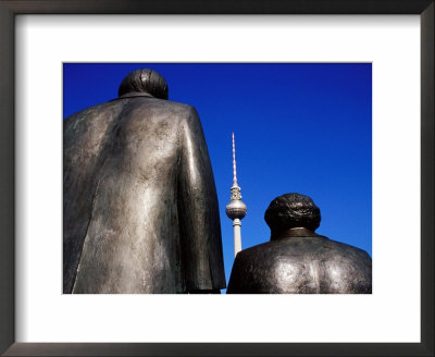 Statues Of Karl Marx, Friedrich Engels With Television Tower In Background, Berlin, Germany by Krzysztof Dydynski Pricing Limited Edition Print image