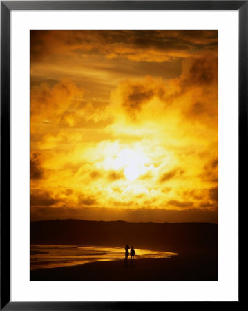 Couple In Silhouette On Beach Beneath Sunset, Isla Santa Cruz, Galapagos, Ecuador by Mark Newman Pricing Limited Edition Print image