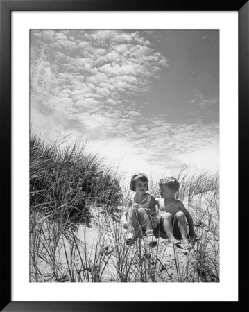 Children Sitting On A Sand Dune by Cornell Capa Pricing Limited Edition Print image