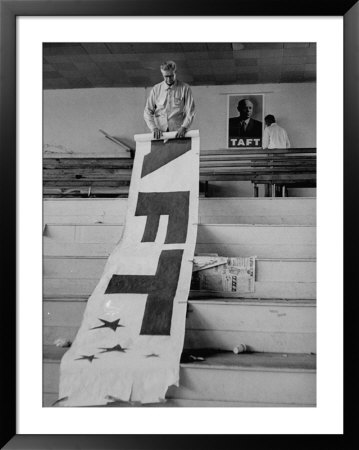 After The Gop Convention A Man Is Rolling Up A Taft Banner by John Dominis Pricing Limited Edition Print image