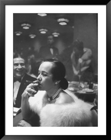 Woman Tries Lady's Cigar In Club After Release Of Surgeon General's Report On Smoking Hazards by Ralph Morse Pricing Limited Edition Print image