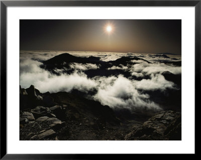 Softened By Haze, The Rising Sun Glows Over Patchy Clouds Which Partially Obscure The Crater by William Allen Pricing Limited Edition Print image