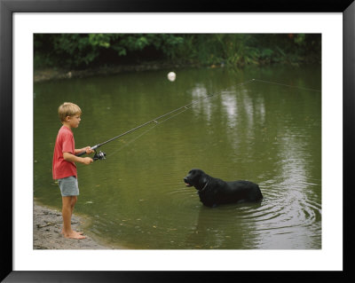 Boy Fishing In A Pond With A Black Labrador Retriever Standing In The Water by Brian Gordon Green Pricing Limited Edition Print image