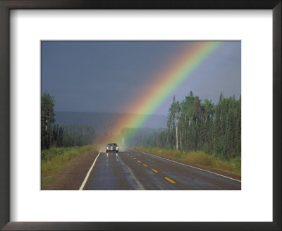 A Car On A Highway Drives Close To A Rainbow by Paul Nicklen Pricing Limited Edition Print image