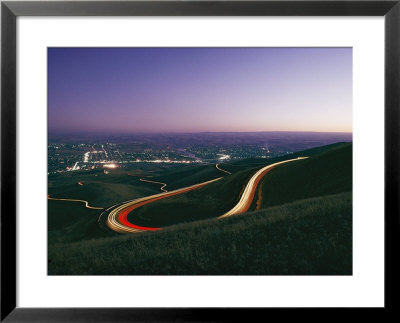 Time Exposure Of Headlights Streaking Down A Highway At Twilight by Dick Durrance Pricing Limited Edition Print image
