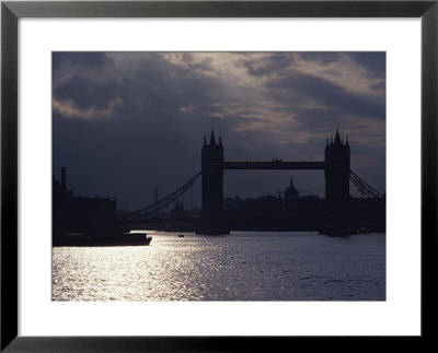 The Recently Renovated Tower Bridge Is Nearly Silhouetted Against A Cloudy London Sky by O. Louis Mazzatenta Pricing Limited Edition Print image
