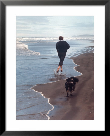 Presidential Candidate Bobby Kennedy And His Dog, Freckles, Running On Beach by Bill Eppridge Pricing Limited Edition Print image