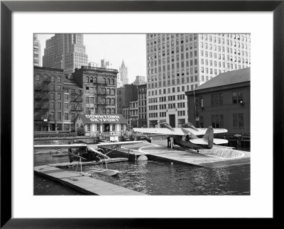 Manhattan's East River Downtown Skyport With Grumman And Fairchild Amphibious Planes by Margaret Bourke-White Pricing Limited Edition Print image