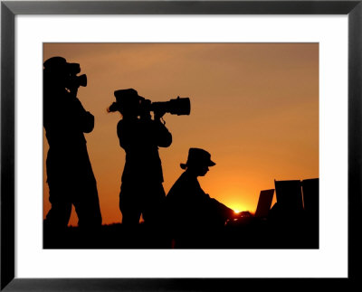Three Us Air Force Members Highlighted By The Setting Sun by Stocktrek Images Pricing Limited Edition Print image