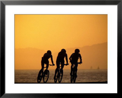 Silhouette Of Three Men Riding On The Beach by Mitch Diamond Pricing Limited Edition Print image