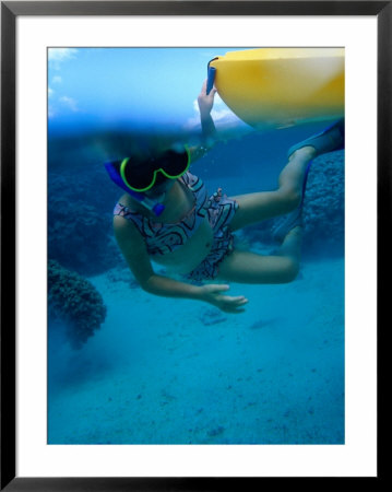Girl Snorkelling While Holding Onto Canoe, Cook Islands by Philip & Karen Smith Pricing Limited Edition Print image