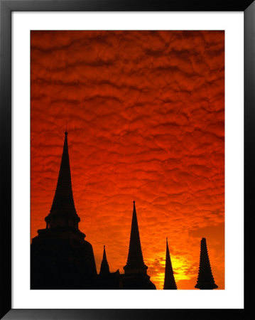 Brilliant Sunset Clouds Blanket The Sky Over The Chedis Of Wat Phra Si Sanphet, Thailand by Anders Blomqvist Pricing Limited Edition Print image