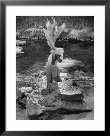 Washing Clothes In A Primitive Open Air Laundry by Walter Sanders Pricing Limited Edition Print image