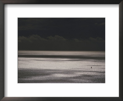 A Lone Boat Sails On A Silvery Sea by Jodi Cobb Pricing Limited Edition Print image