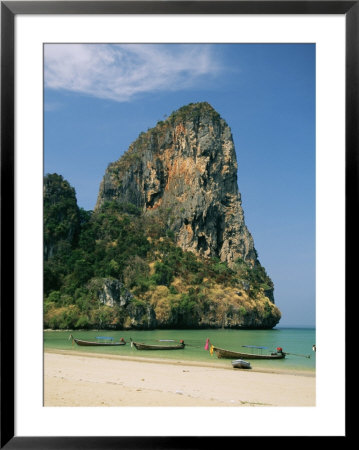 Boats And Rock Formation At Railey Beach On The Andaman Sea Coast by Mark Cosslett Pricing Limited Edition Print image