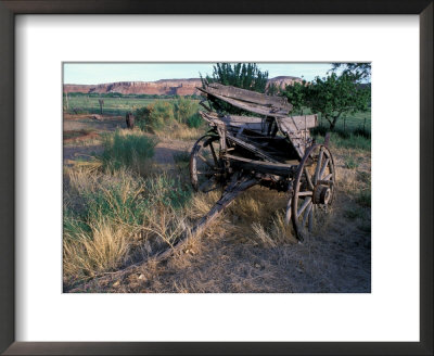 Old Wagon Behind The Cow Canyon Trading Post, Bluff, Utah, Usa by Jerry & Marcy Monkman Pricing Limited Edition Print image