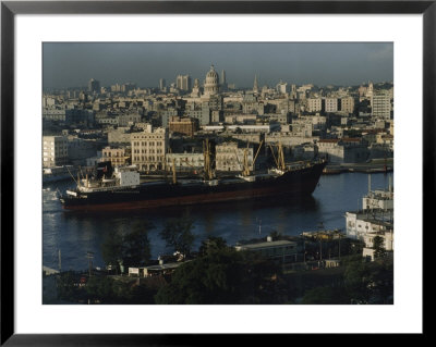 City And A Massive Freighter As It Cruises The Canal, Havana, Cuba by James L. Stanfield Pricing Limited Edition Print image