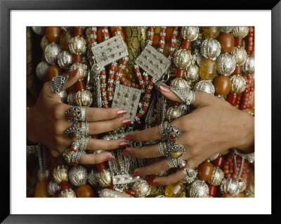 Close-Up Of A Bride's Hands Displays Silver Rings Against Necklaces by James L. Stanfield Pricing Limited Edition Print image