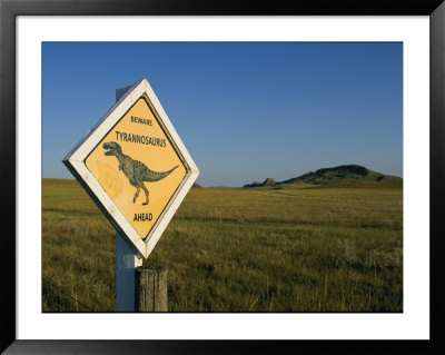 A Playful Sign Warns Motorists To Watch Out For Dinosaurs by Ira Block Pricing Limited Edition Print image