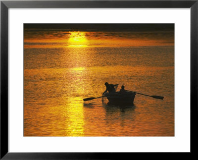 Rowing Boat On Ganges River At Sunset, Varanasi, India by Keren Su Pricing Limited Edition Print image