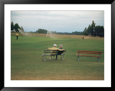 Golfers Sitting On Bench Near Practice Greens While Awaiting Tee Time On Pinehurst Golf Course by Walker Evans Pricing Limited Edition Print image