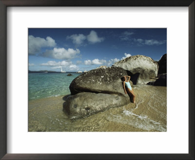 Young Woman Resting Against A Rock On A Pristine Beach by Bill Curtsinger Pricing Limited Edition Print image