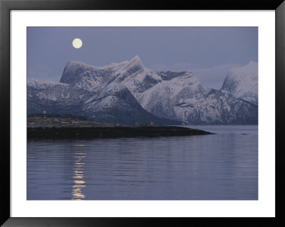 The Moon Rises Over Mountains At Waters Edge In The Norwegian Arctic by Brian J. Skerry Pricing Limited Edition Print image