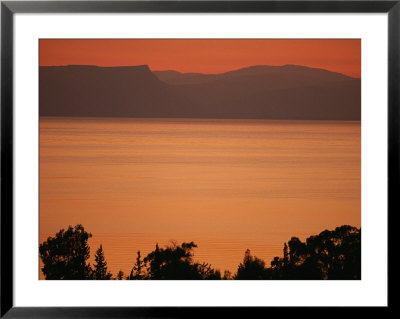 Sunset Paints The Sea Of Galilee Orange by Annie Griffiths Belt Pricing Limited Edition Print image