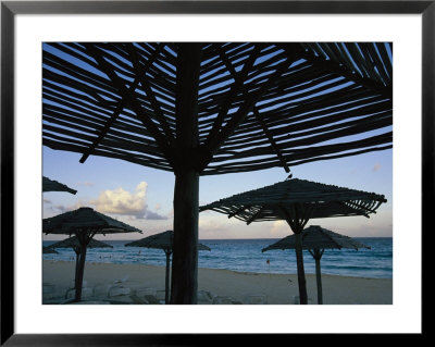 Wooden Umbrellas Dot The Cancun Beach by Michael Melford Pricing Limited Edition Print image