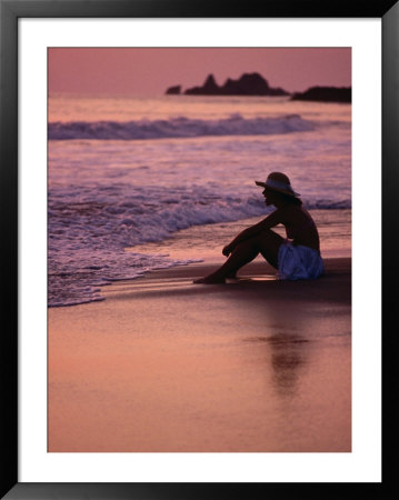 Woman Sitting On Beach At Sunset In Ixtapa, Near Zihuatanejo, Zihuatanejo, Mexico by Philip Smith Pricing Limited Edition Print image