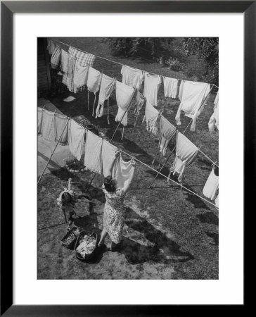 Mother Hanging Laundry Outdoors During Washday by Alfred Eisenstaedt Pricing Limited Edition Print image