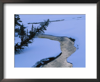 A Twilight View Of Baronette Creek Winding Through A Snowy Landscape by Raymond Gehman Pricing Limited Edition Print image