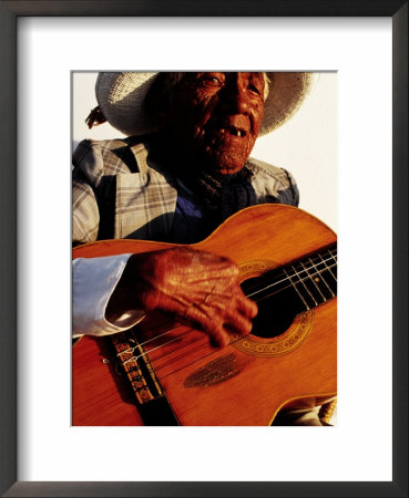 Portrait Of Old Man Playing Guitar, Paracas, Peru by Jeffrey Becom Pricing Limited Edition Print image