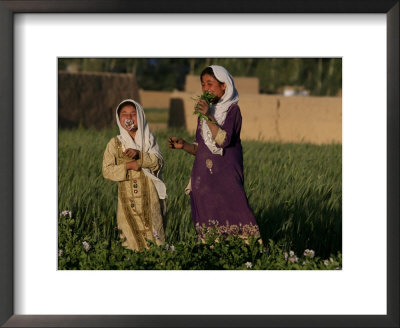 Two Girls Play In The Bamiyan Valley, Next To The Buddha Statue That Was Destroyed, July 19, 2006 by Rodrigo Abd Pricing Limited Edition Print image