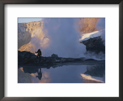 A Climber Hikes Among Crater Pools And Fumaroles by Peter Carsten Pricing Limited Edition Print image