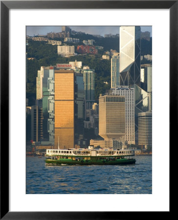 Star Ferry Crossing Hong Kong Harbour With The Towers Of Hong Kong Island Beyond, Hong Kong, China by Greg Elms Pricing Limited Edition Print image