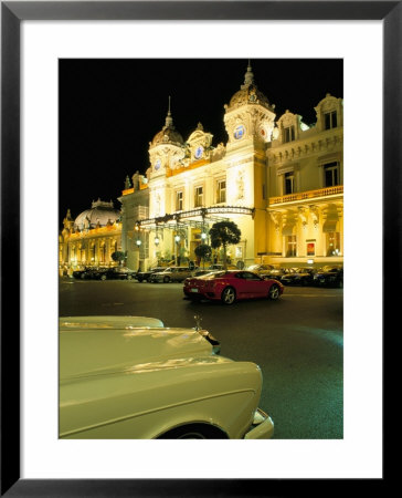 Rolls Royce And Ferrari Parked In Front Of The Casino At Night, Monte Carlo, Monaco by Ruth Tomlinson Pricing Limited Edition Print image