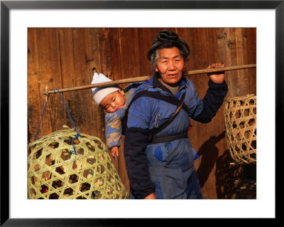 Miao Woman With A Baby And Carrying Chicken Cages, Kaili, China by Keren Su Pricing Limited Edition Print image