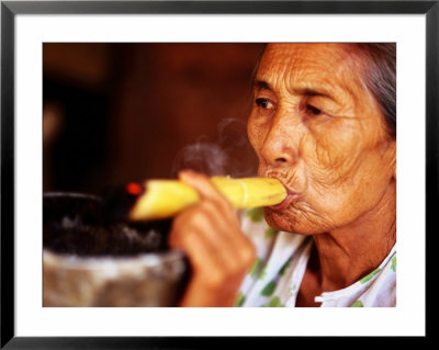 Woman Smokes Handmade Cheroot With Large Ashtray, Bagan, Myanmar (Burma) by Anthony Plummer Pricing Limited Edition Print image