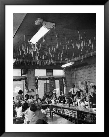 Soda Fountain Proprietor Watching As Kids Use Drinking Straw Covers As Straw Blowgun Missiles by Wallace Kirkland Pricing Limited Edition Print image