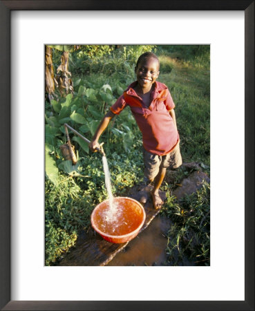 Boy At Water Tap, Chuka Village, Mount Kenya, Kenya, East Africa, Africa by Duncan Maxwell Pricing Limited Edition Print image
