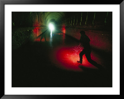 A Time Exposure Of A Figure In The Potomac River Tunnel by Joel Sartore Pricing Limited Edition Print image