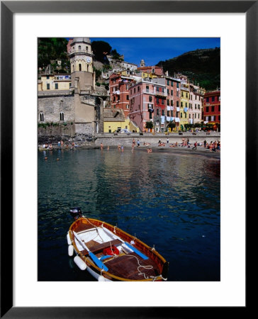 Brightly Coloured Buildings Of Cinque Terre With Rowboat In Foreground, Vernazza, Italy by Glenn Beanland Pricing Limited Edition Print image