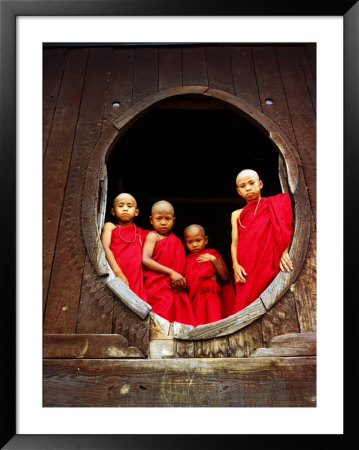 Portrait Of Four Young Monks At Round Monastery Window, Inle Lake, Myanmar (Burma) by Anthony Plummer Pricing Limited Edition Print image