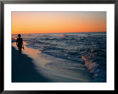 Woman Walking On The Beach Into The Sunset, Fl by Ken Glaser Pricing Limited Edition Print image