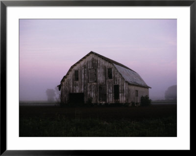 Pink Dawn Mist Around A Weather-Beaten Barn by Stephen St. John Pricing Limited Edition Print image