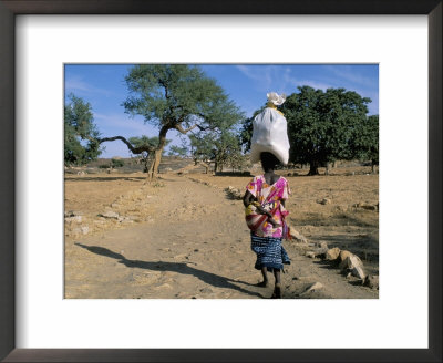 Woman Carrying Sack On Her Head, Ogol Village, Sangha, Dogon Area, Mali, Africa by Bruno Morandi Pricing Limited Edition Print image