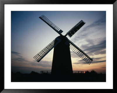 Windmill Silhouetted Against Sky At Sunset, The Cotswolds, Wiltshire, England by Jon Davison Pricing Limited Edition Print image