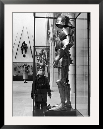 Little Boy Staring Up At Medieval Suit Of Armor In The Metropolitan Museum Of Art by Alfred Eisenstaedt Pricing Limited Edition Print image