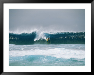 Surfer Rides A Breaking Wave In The Bonsai Pipeline In Oahu by Todd Gipstein Pricing Limited Edition Print image